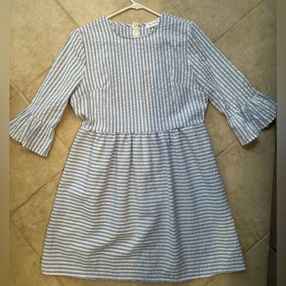 Woman’s blue and white seersucker dress